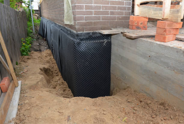Happy homeowners after waterproofing job in Islip